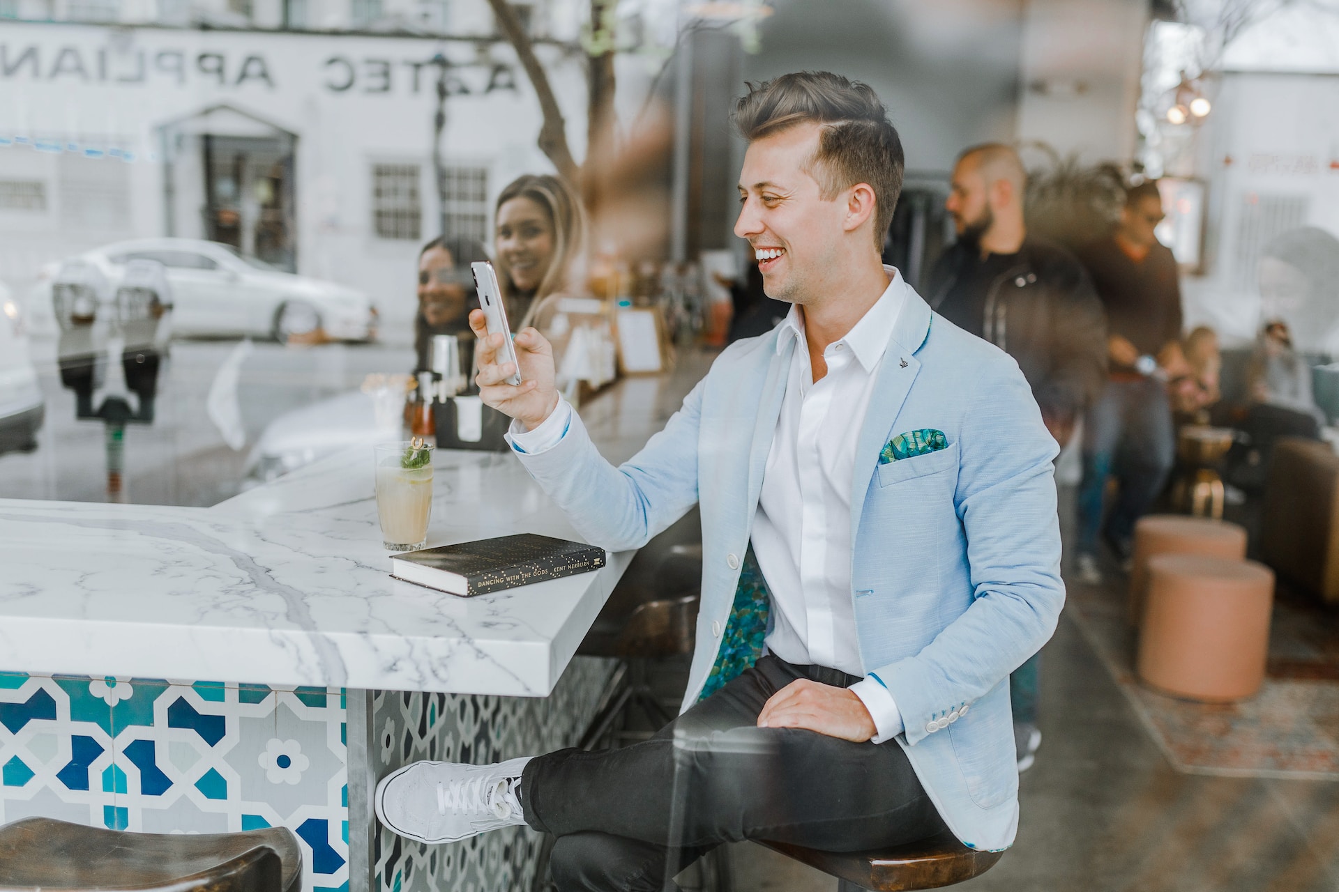 Smiling man looking at his phone