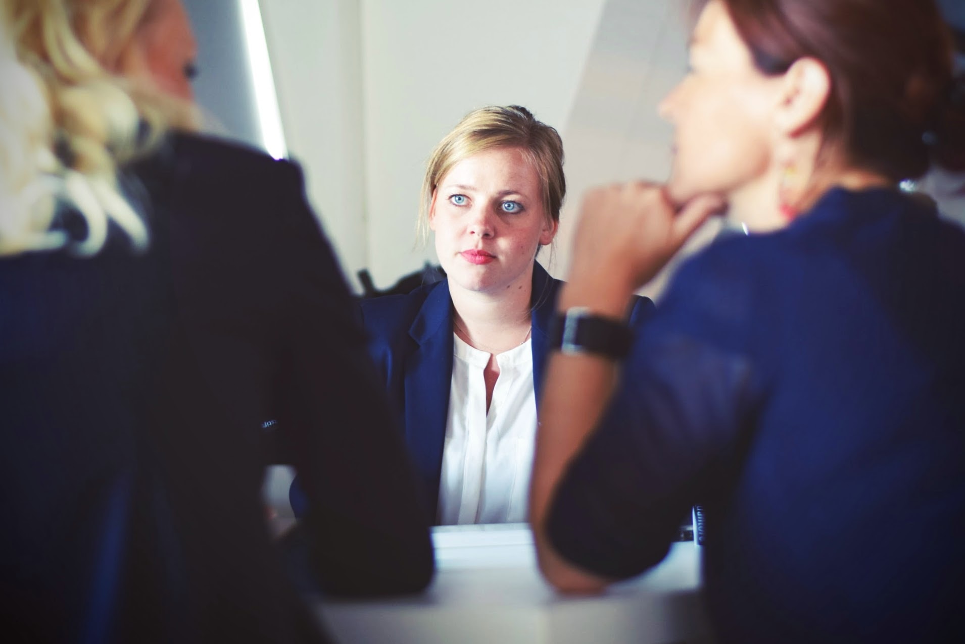 Woman being interviewed by two colleagues